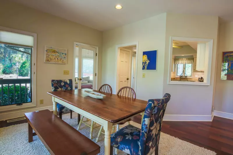 From the dining table, you can access the sunroom and the kitchen.