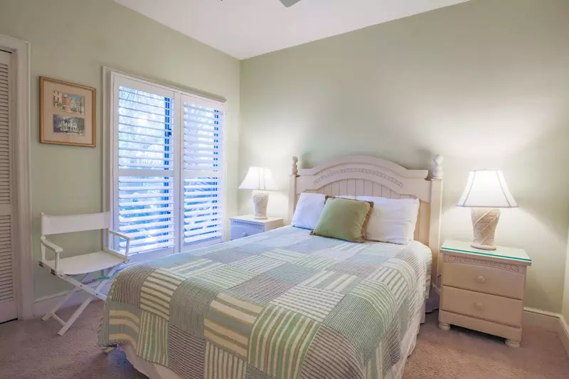 This guest bedroom looks out onto the front side of the home.