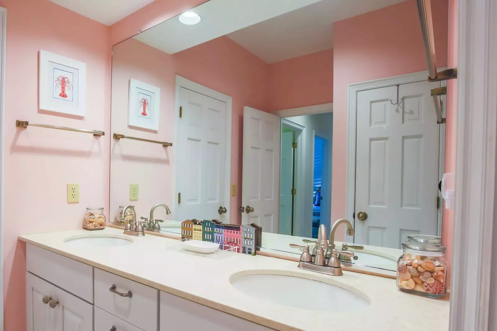 This bathroom, which is accessible from both the queen guest bedroom and the hall, features a double sink vanity.