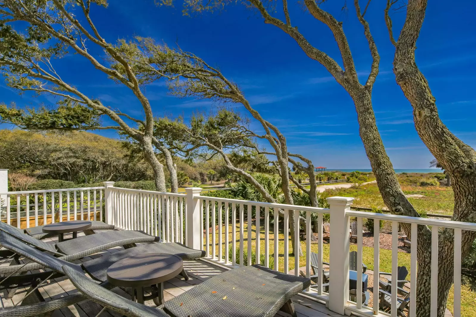When you climb the exterior stair case to the middle level, you'll find this spacious deck with ocean views and loungers.