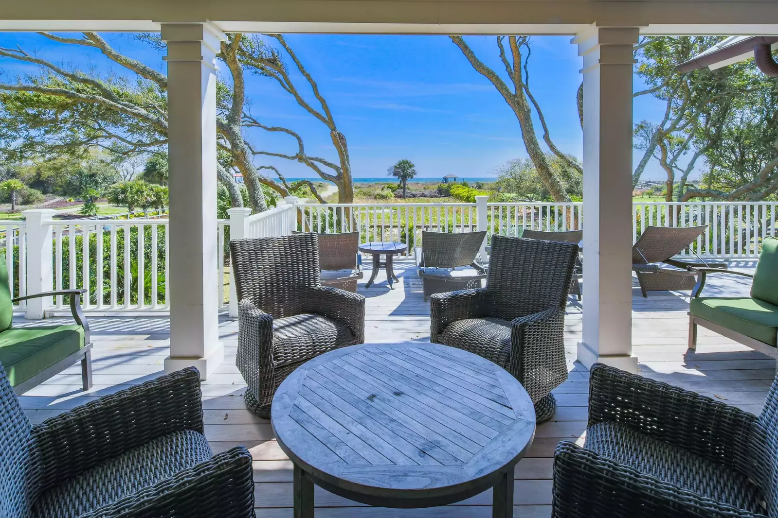 There is a seating area on the covered portion of the deck.