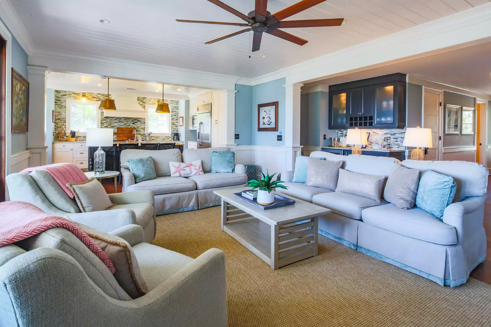 This comfortable living room connects to the back porch and the kitchen.