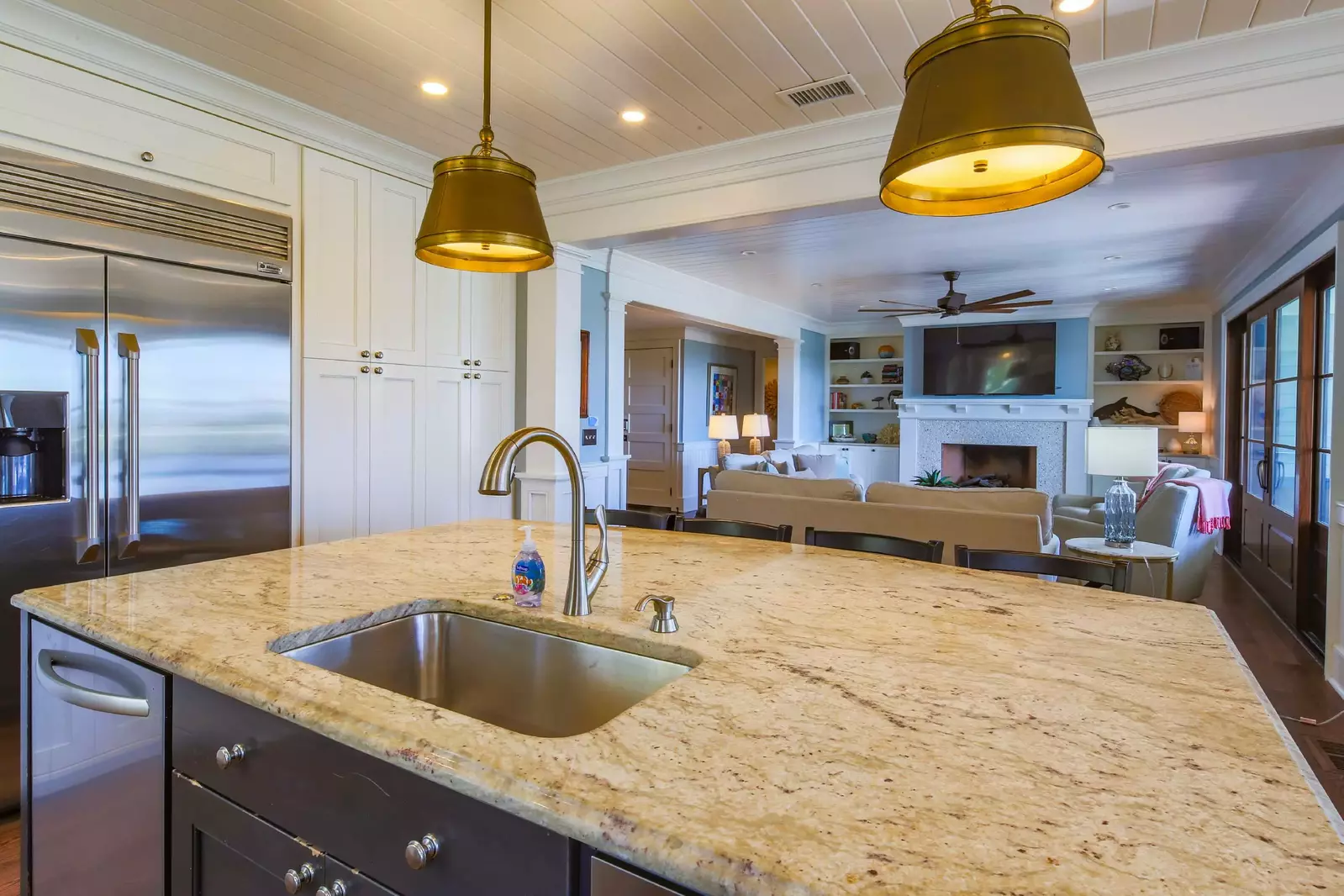 There is an open layout between the living room and the kitchen.