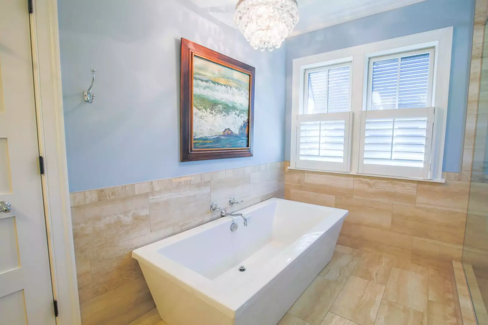 The master suite has beautifully tiled walls & floor as well as a stand alone soaking tub.
