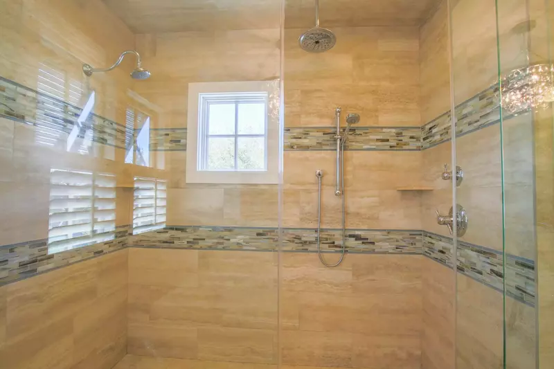 The walk-in shower in the master bathroom has three shower heads.