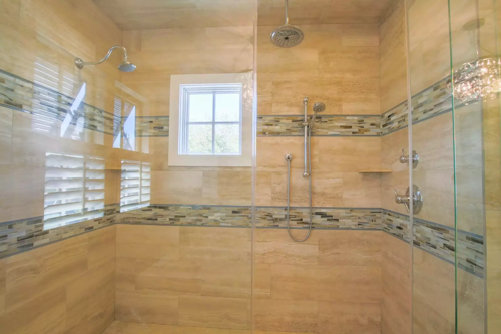 The walk-in shower in the master bathroom has three shower heads.