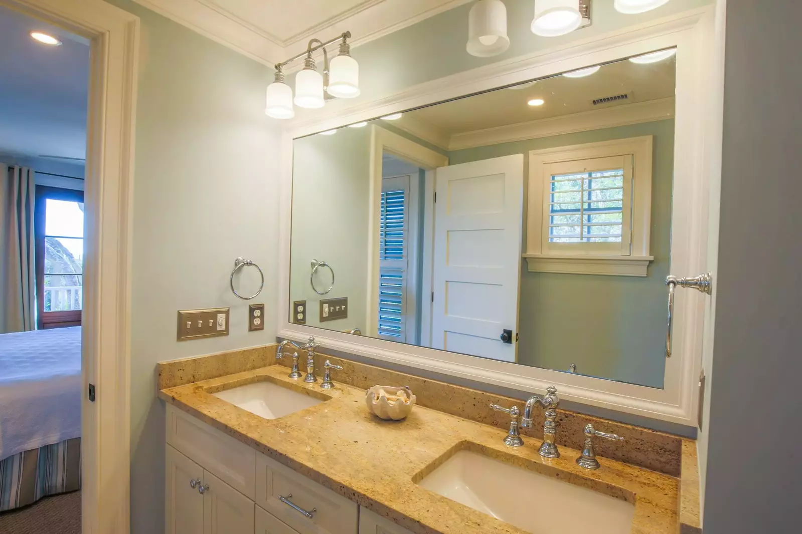 The en suite bathroom for the lower level master suite has a double sink vanity.