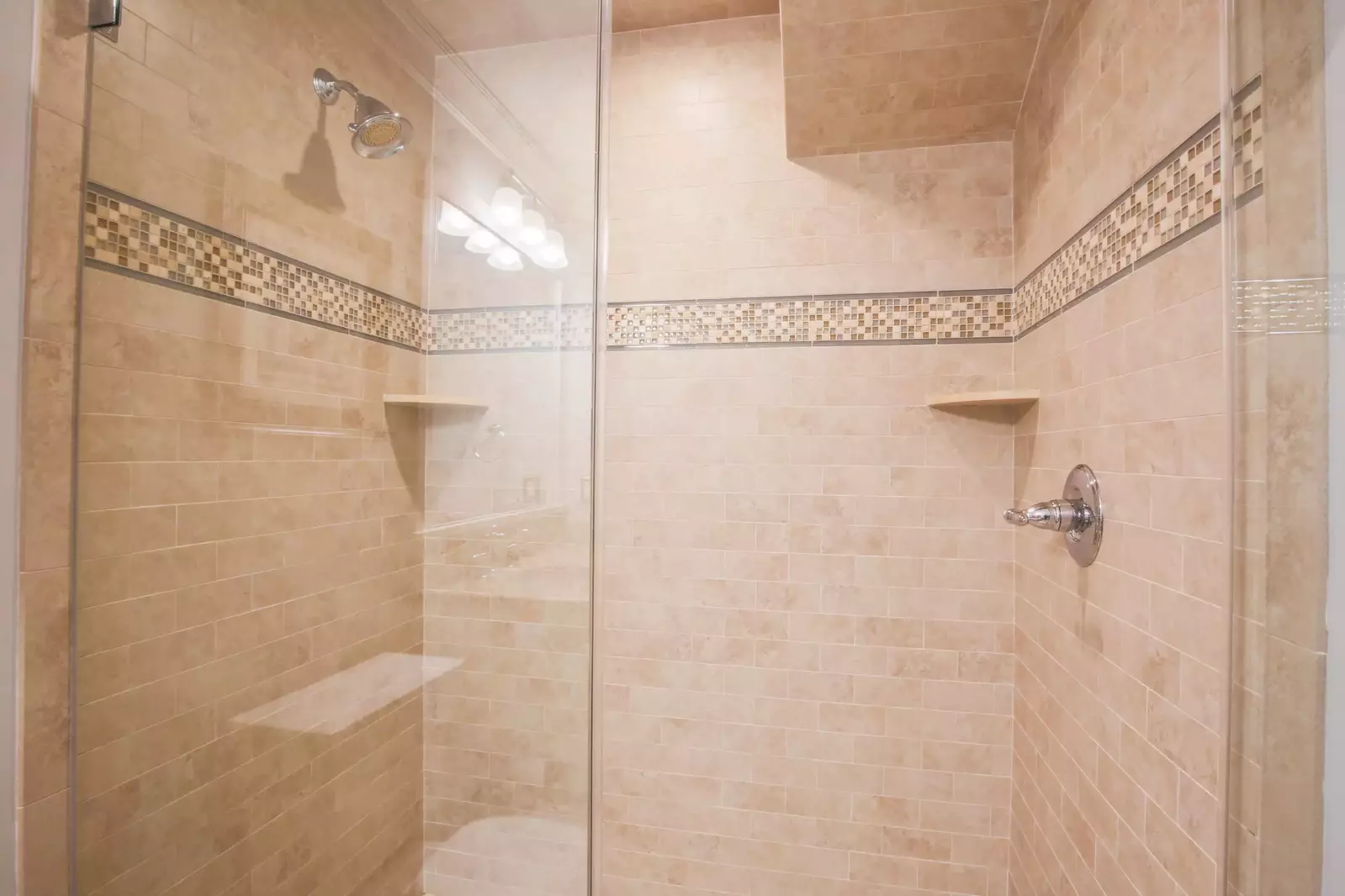 The en suite bathroom also features this tiled, walk-in shower.