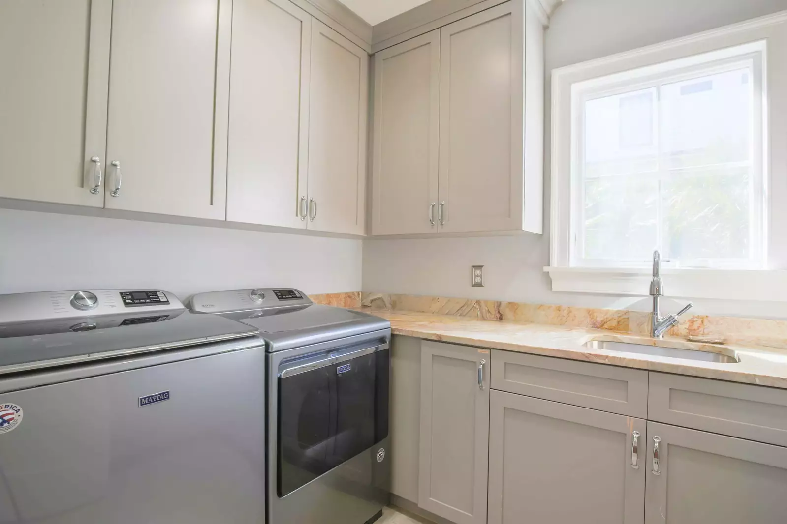 There's a full laundry room with washing machine, dryer and a utility sink on the home's lower level.