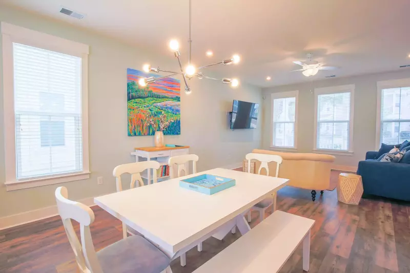 The dining table seats 6 and there are 2 stools at the kitchen island.