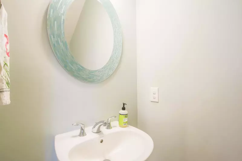 There is a half bathroom on the lower level near the living room.
