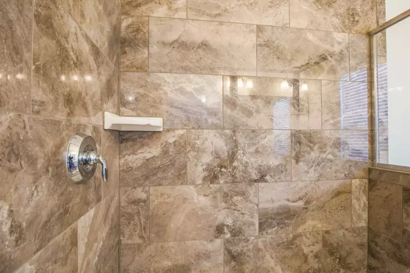 This tiled, walk-in shower is also located within the master bathroom.
