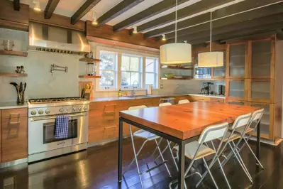This beautiful, chef's kitchen features Thermador appliances and custom cabinetry.
