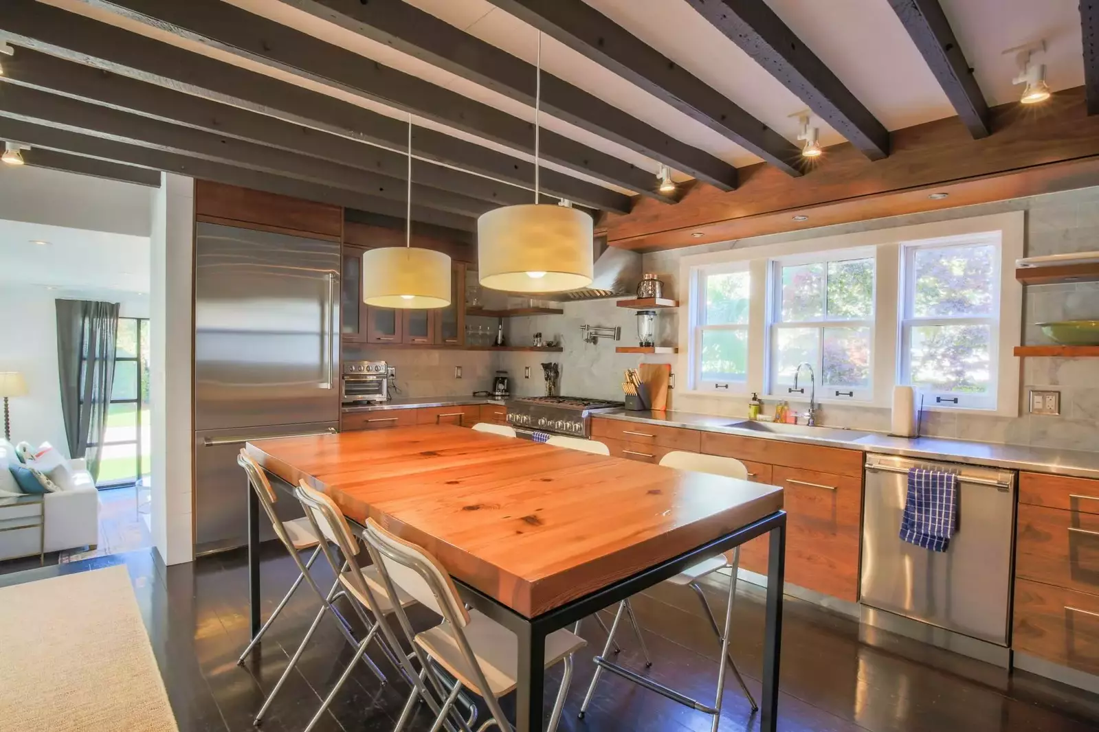 The kitchen features a refrigerator, range, dishwasher, toaster oven & air fryer and drip coffee maker.
