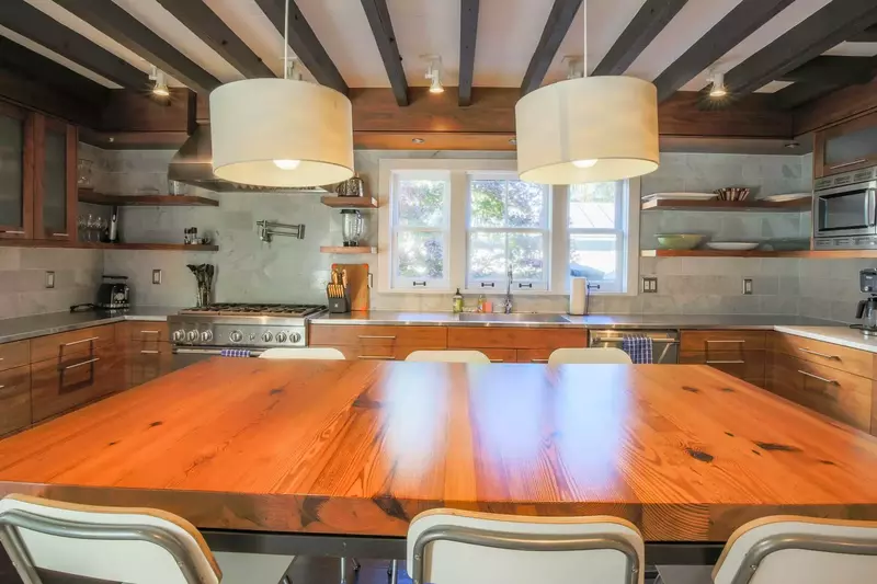 The kitchen is centered around this dining table that seats 6 people.