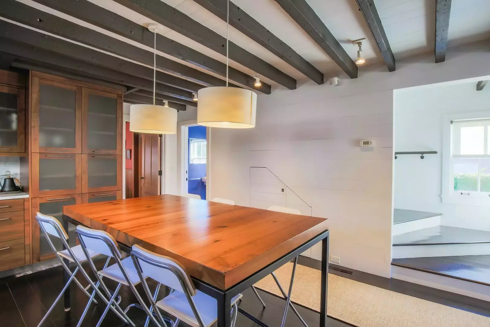 There's a half bathroom and a bonus room located off of the kitchen.