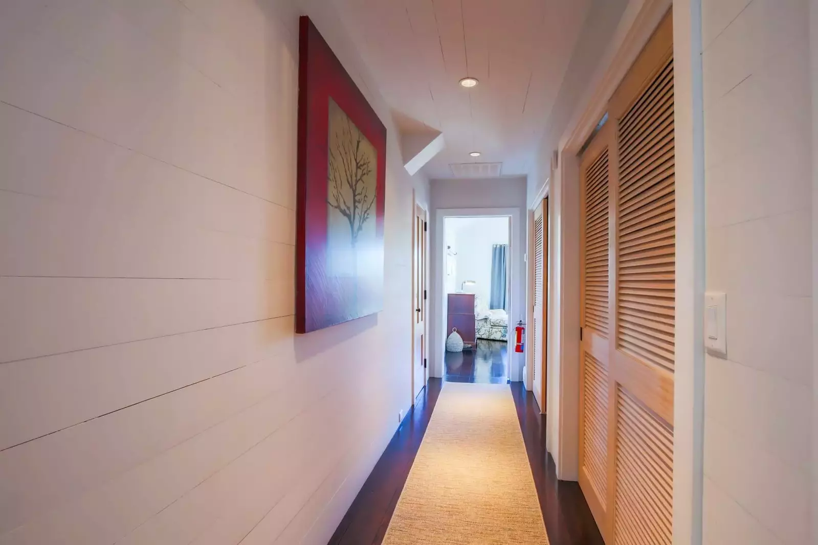 This hallway separates the two master suites on the home's second floor.
