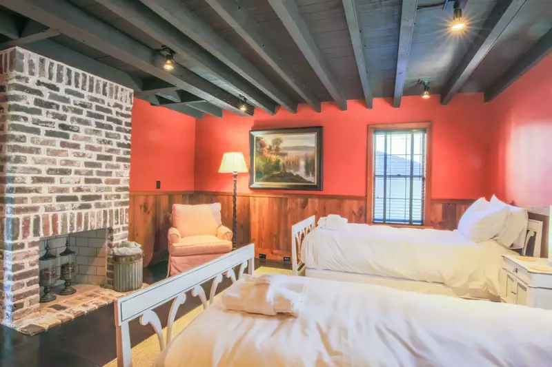 On the home's first floor, you'll find this bonus room with two twin beds.