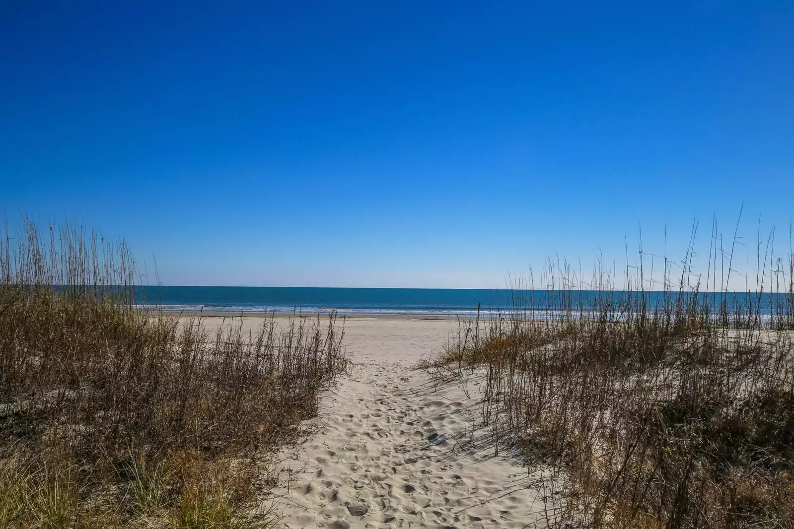 You can dip your toes in the sand within minutes of walking out of the home!