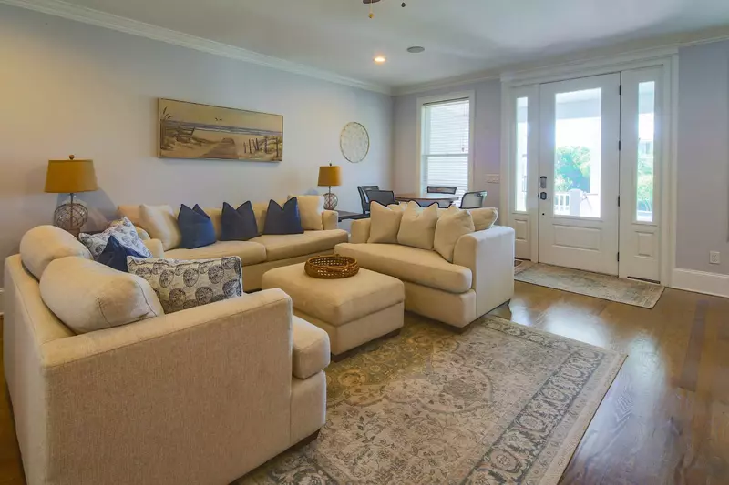 When you enter the home's front door, you'll find this comfortable den with spacious seating.