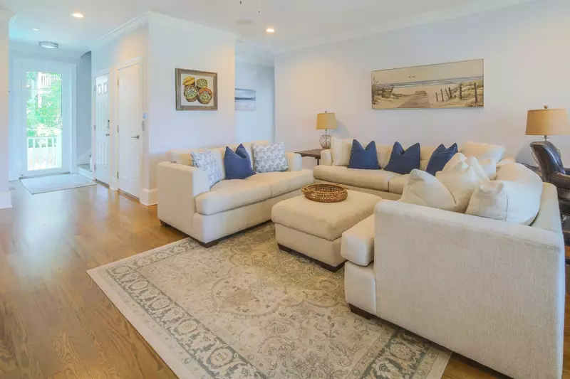 The lower level of the home features 4 bedrooms that are situated around this den.