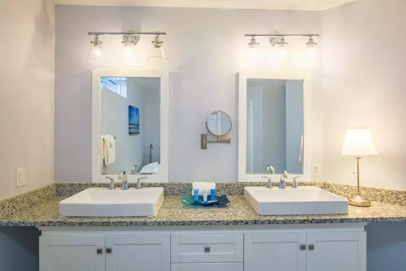 The master bathroom has a spacious, double sink vanity.