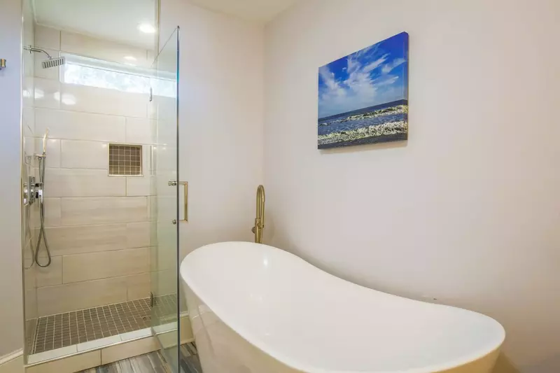 The master bathroom also has a tiled, walk-in shower and a soaking tub.