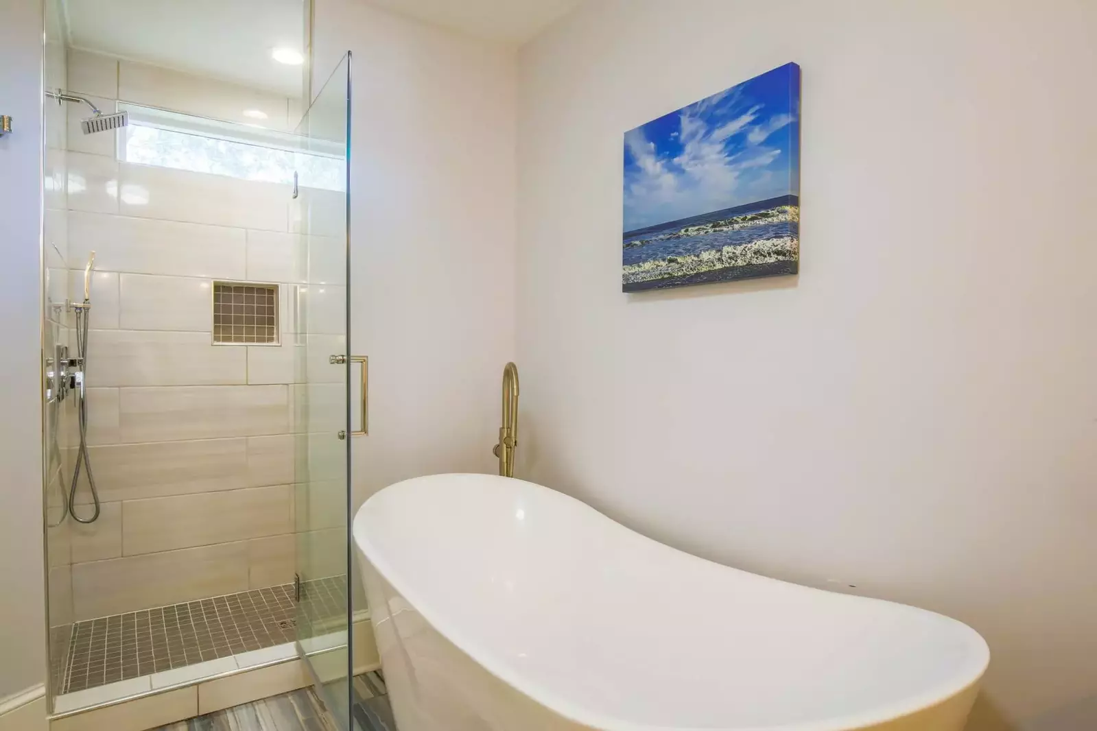 The master bathroom also has a tiled, walk-in shower and a soaking tub.