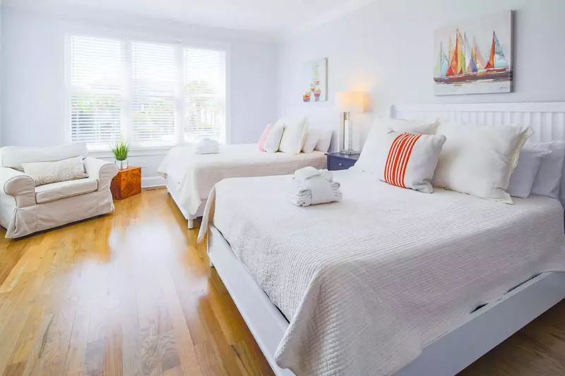This first floor guest bedroom has two queen beds and access to a Jack & Jill shared bathroom.
