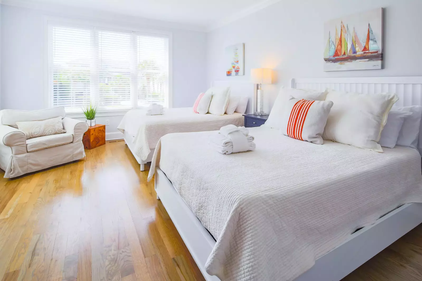 This first floor guest bedroom has two queen beds and access to a Jack & Jill shared bathroom.