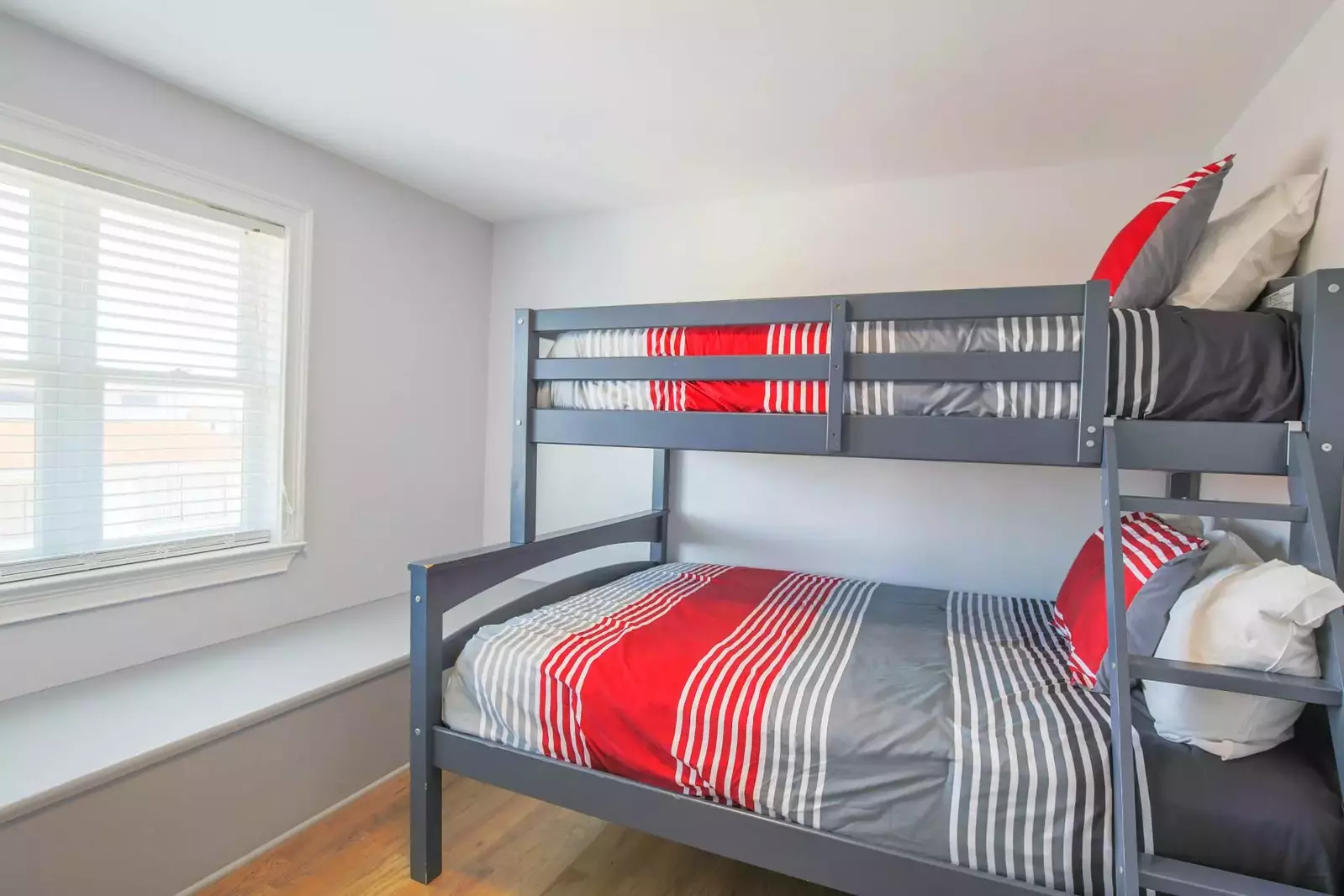 This bunk bedroom -- with a full and twin beds -- is located on one side of the game room.
