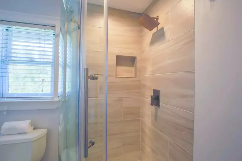 The third floor bathroom also has a tiled, walk-in shower.