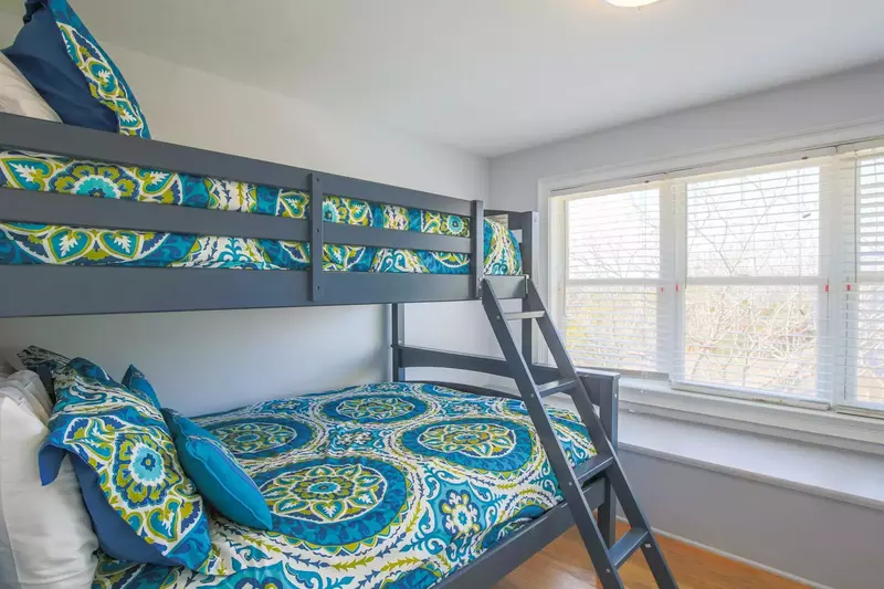 This bunk bedroom -- also with a full and twin beds -- is located on the other side of the game room.