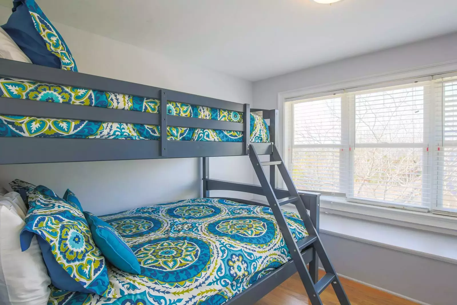 This bunk bedroom -- also with a full and twin beds -- is located on the other side of the game room.