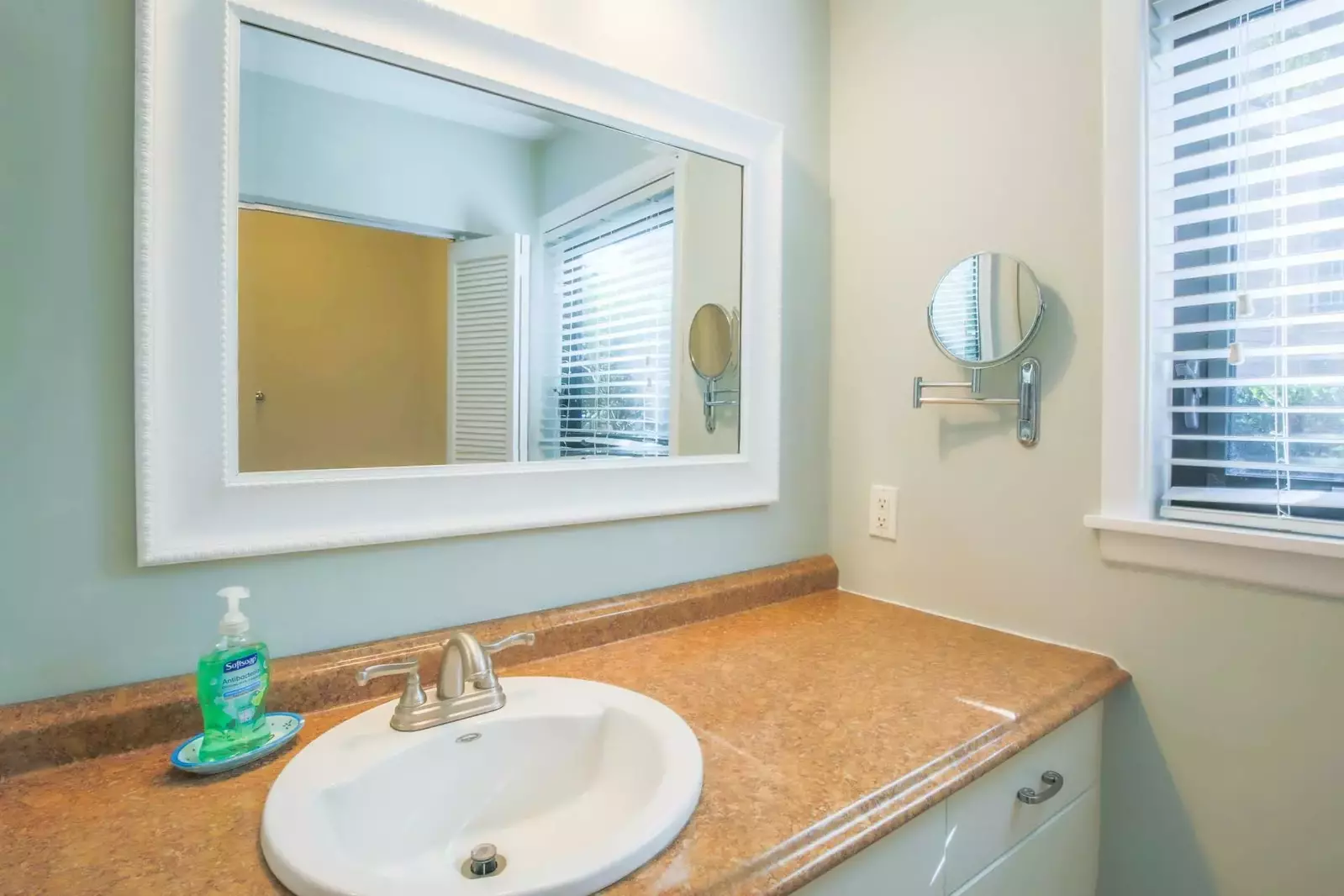 The master bedroom has an en suite bathroom with a spacious vanity.