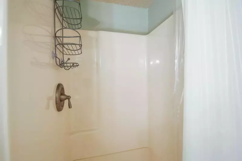 The hallway bathroom also has a walk-in shower.