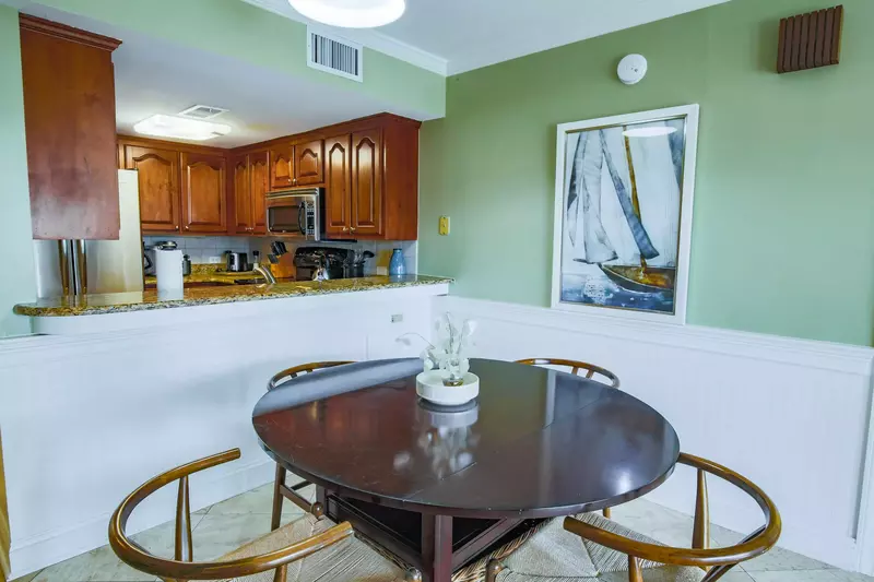 The dining table seats 4. There's an additional dining table on the screened porch that seats 6.