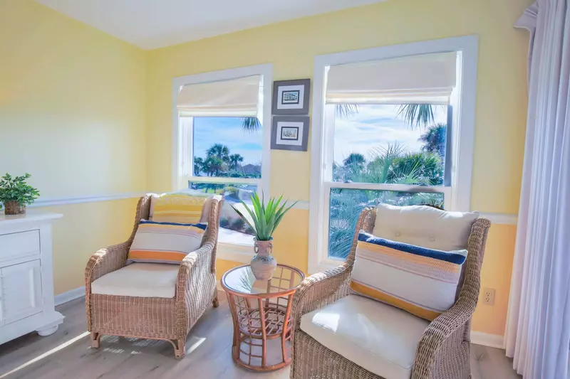 There is a comfortable seating area in the master suite near the sliding glass door to the screened porch.