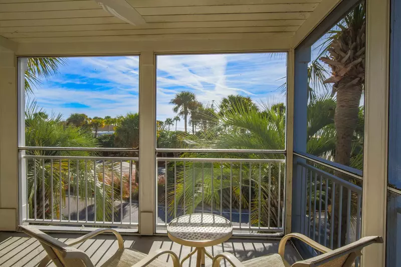 Grab a seat and listen to the sound of the crashing waves on the screened porch.