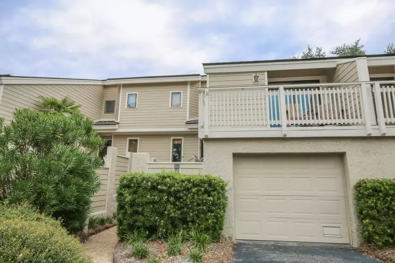 Follow the sidewalk from the driveway, past the outdoor shower to the Fairway to Heaven front door.