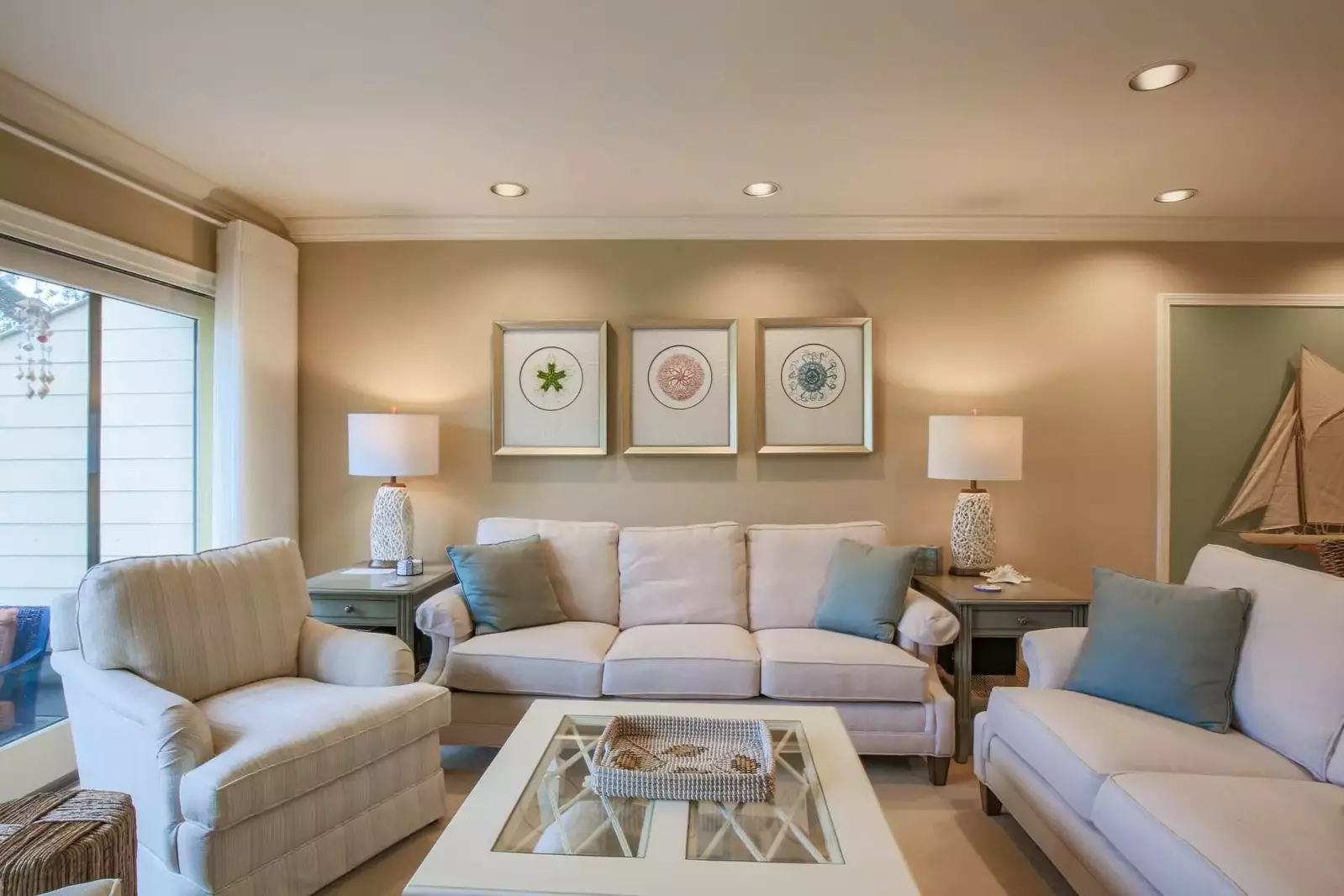 The living room features plenty of seating for your family.