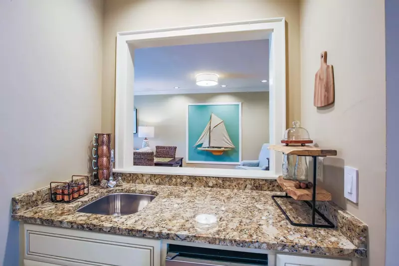 The butler's pantry features an ice maker and small sink.