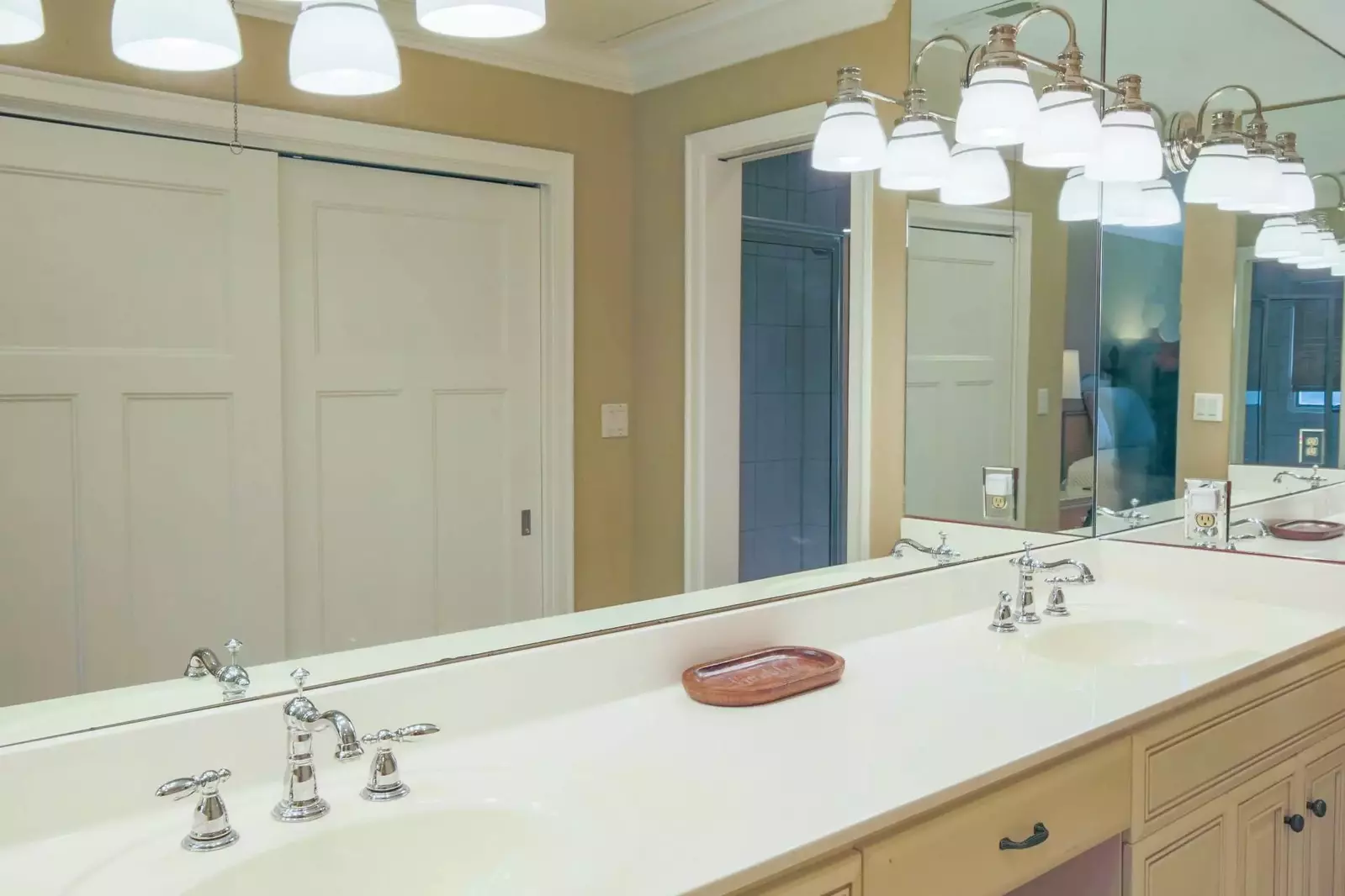 The en suite bathroom for the master bedroom features a long, double sink vanity.