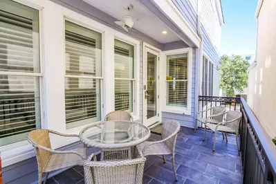 This partially-covered back porch is situated off of the home's living room.