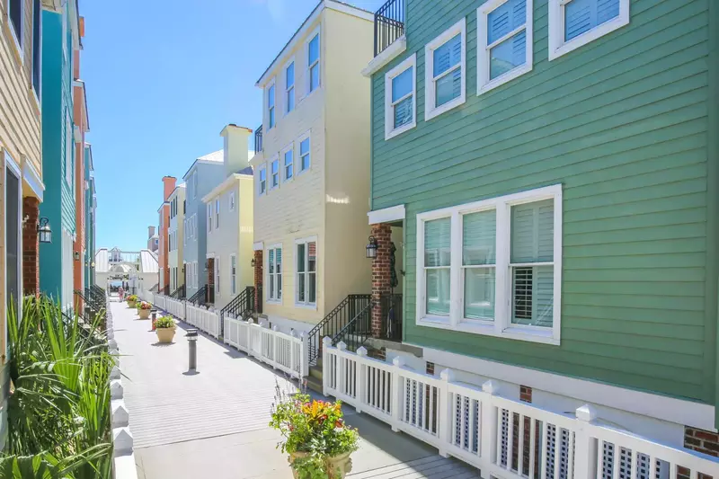 The balcony extends to the Grand Pavilion community pools and beach access points.