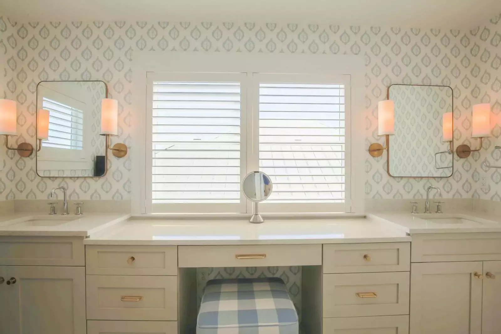 Each of the bathrooms has been decorated with coastal-colored wallpaper and designer light fixtures.