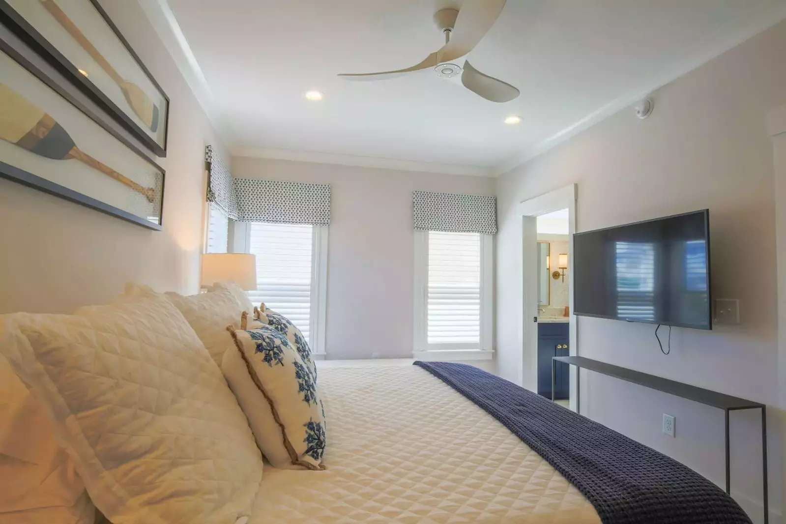The second master suite also has a mounted smart TV, ceiling fan and en suite bathroom.