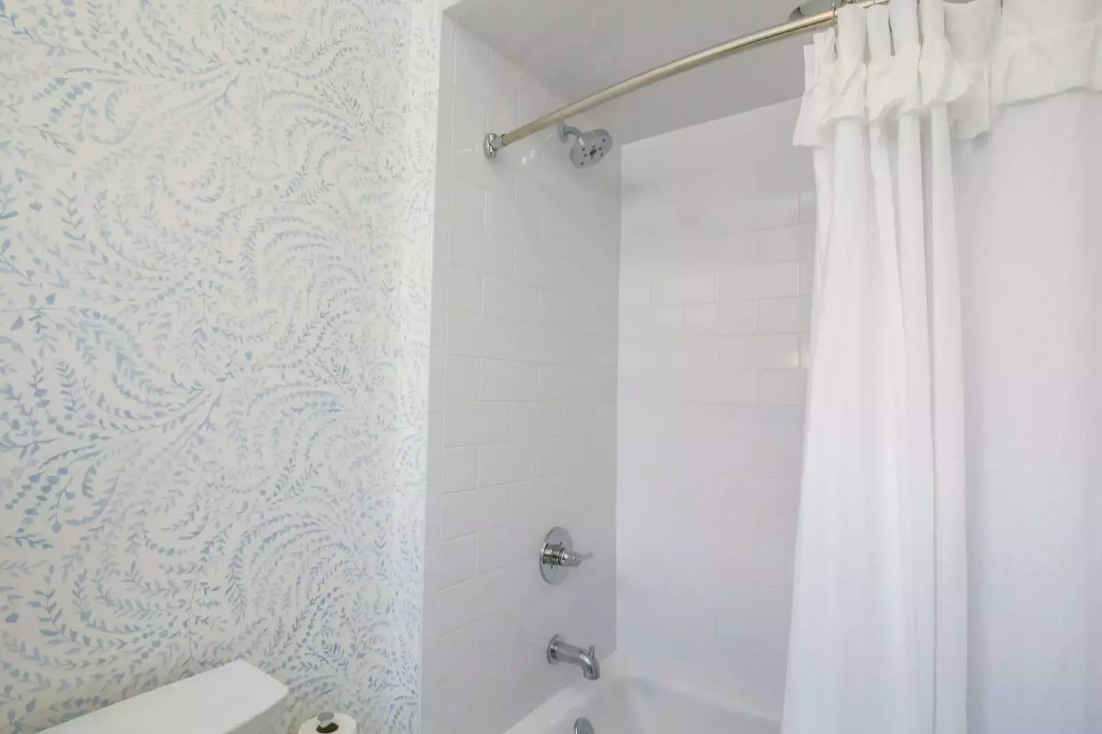 The en suite bathroom for the second master suite also has a shower/tub combo.