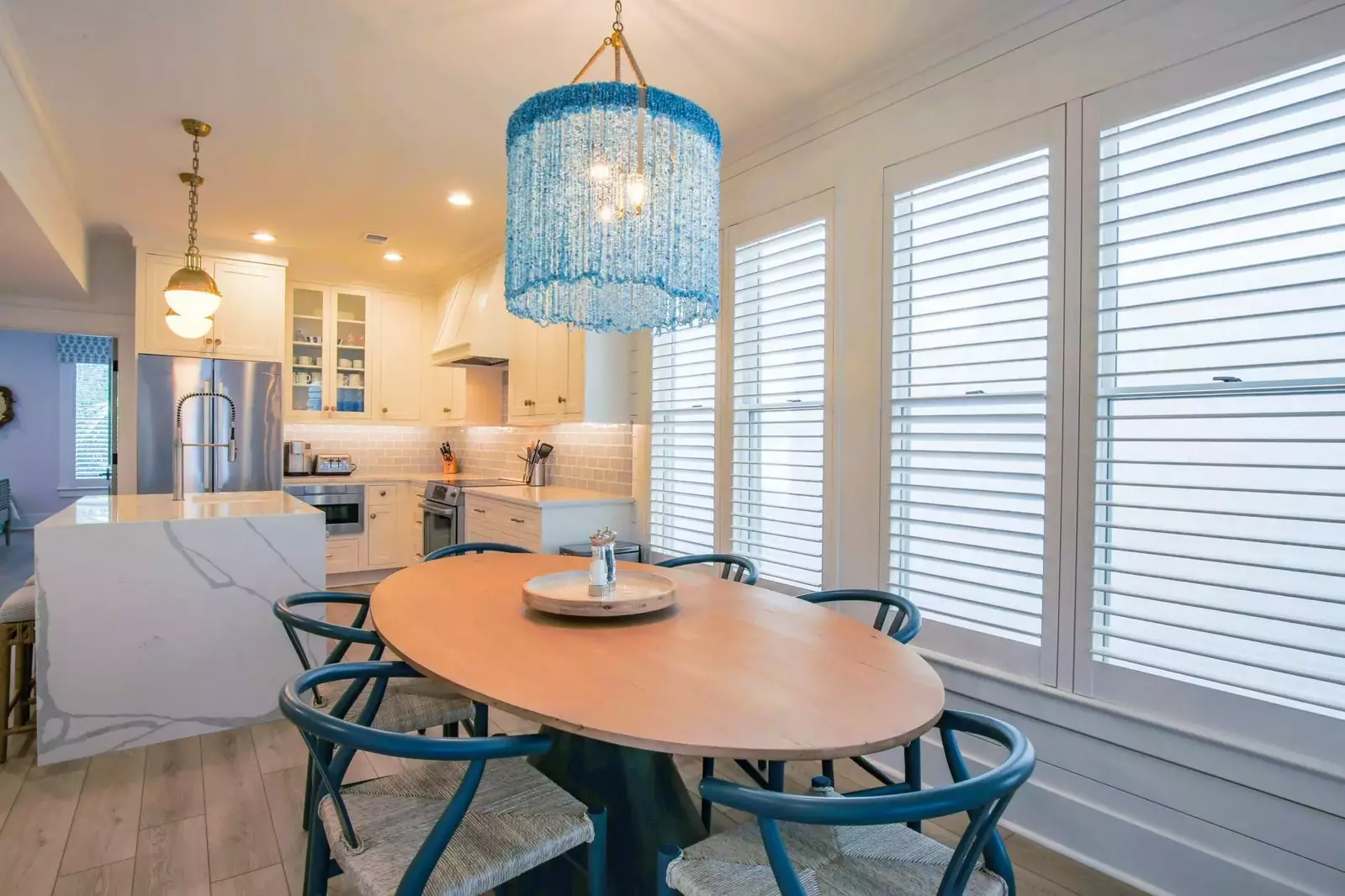 The guest bedroom on the first floor is located off of the kitchen.