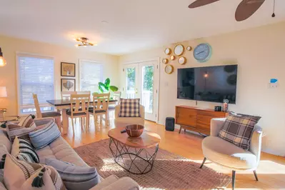 Heron Hideaway has an open floor plan with terrific natural light between the living room and dining area.